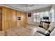 Den with wood built-ins, sofa, and large window at 2003 Captiva Ct, Sun City Center, FL 33573