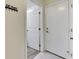 Home entryway with two white doors and tile flooring at 2003 Captiva Ct, Sun City Center, FL 33573