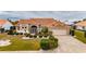 One-story home with attractive landscaping and a paved driveway at 2003 Captiva Ct, Sun City Center, FL 33573
