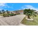One story home with paver driveway and palm tree at 2003 Captiva Ct, Sun City Center, FL 33573
