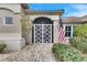 Front entry with decorative screen door and American flag at 2003 Captiva Ct, Sun City Center, FL 33573