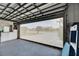 Bright garage with view of backyard, offering extra storage at 2003 Captiva Ct, Sun City Center, FL 33573