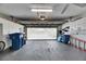 Spacious garage with overhead door and ample storage at 2003 Captiva Ct, Sun City Center, FL 33573