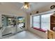 Kitchen with breakfast nook and access to a screened patio at 2003 Captiva Ct, Sun City Center, FL 33573