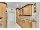 Kitchen with extensive cabinetry and granite countertops at 2003 Captiva Ct, Sun City Center, FL 33573