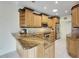Kitchen with granite countertops and an island at 2003 Captiva Ct, Sun City Center, FL 33573