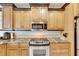 Kitchen boasts granite countertops and stainless steel appliances at 2003 Captiva Ct, Sun City Center, FL 33573
