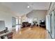 Large living room with hardwood floors and views of entryway and patio at 2003 Captiva Ct, Sun City Center, FL 33573