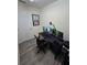 Home office with a large desk, multiple monitors, and comfortable chair at 2003 Captiva Ct, Sun City Center, FL 33573
