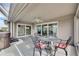 Covered patio with seating area, hot tub, and sliding glass doors at 2003 Captiva Ct, Sun City Center, FL 33573