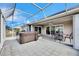 Spacious patio with hot tub and seating area, perfect for relaxing outdoors at 2003 Captiva Ct, Sun City Center, FL 33573
