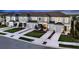 New townhome community with attached garages and lush landscaping at 2123 Hallier Cv, Wesley Chapel, FL 33543