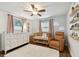 Bright Bedroom features a crib, dresser, and comfy chair at 2126 7Th N Ave, St Petersburg, FL 33713