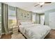 Bright bedroom with large bed, ceiling fan, and neutral decor at 2126 7Th N Ave, St Petersburg, FL 33713