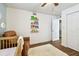 Charming Bedroom with a crib, recliner, and floating shelves at 2126 7Th N Ave, St Petersburg, FL 33713