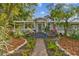 Charming bungalow with a welcoming front porch and beautifully landscaped yard at 2126 7Th N Ave, St Petersburg, FL 33713