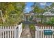 Charming house with a white picket fence and landscaped yard at 2126 7Th N Ave, St Petersburg, FL 33713