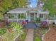 Quaint house exterior with lush landscaping and front porch at 2126 7Th N Ave, St Petersburg, FL 33713