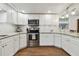 Modern kitchen with white cabinets and granite countertops at 2126 7Th N Ave, St Petersburg, FL 33713