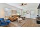 Light and airy living room with a stylish leather couch and large windows at 2126 7Th N Ave, St Petersburg, FL 33713
