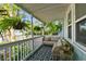 Inviting porch features a cozy seating area and patterned rug at 2126 7Th N Ave, St Petersburg, FL 33713