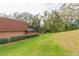 Landscaped backyard with lush greenery at 2601 2Nd Ct, Palm Harbor, FL 34684