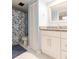 Updated bathroom with granite countertop, white cabinets, and a shower/tub combo at 2601 2Nd Ct, Palm Harbor, FL 34684
