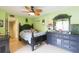 Bedroom with a double bed, dresser, and ceiling fan at 2601 2Nd Ct, Palm Harbor, FL 34684