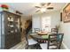 Dining area with round table and chairs, view of staircase and living room at 2601 2Nd Ct, Palm Harbor, FL 34684