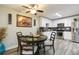 Modern kitchen with white cabinets, granite countertops, and stainless steel appliances at 2601 2Nd Ct, Palm Harbor, FL 34684