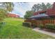 Landscaped lawn and pathway leading to townhouse entrance at 2601 2Nd Ct, Palm Harbor, FL 34684