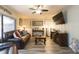 Spacious living room with leather furniture and hardwood floors at 2601 2Nd Ct, Palm Harbor, FL 34684