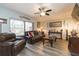 Spacious living room with leather furniture and hardwood floors at 2601 2Nd Ct, Palm Harbor, FL 34684