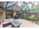 Screened patio with seating area, fire pit, and grill at 2601 2Nd Ct, Palm Harbor, FL 34684