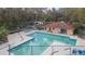 Community pool and spa with surrounding deck at 2601 2Nd Ct, Palm Harbor, FL 34684