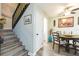 Wooden staircase with a black railing and access to upper floor at 2601 2Nd Ct, Palm Harbor, FL 34684
