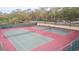Two well-maintained tennis courts at 2601 2Nd Ct, Palm Harbor, FL 34684