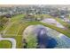 Aerial view of farm with stables and pond at 2972 Lake Saxon Dr, Land O Lakes, FL 34639