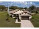 Single Gathering house with a paver driveway and nicely landscaped yard at 2972 Lake Saxon Dr, Land O Lakes, FL 34639