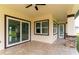 Covered patio with tile flooring, sliding glass doors, and a door at 2972 Lake Saxon Dr, Land O Lakes, FL 34639