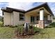 Covered patio with tile flooring, ceiling fan, and sliding glass doors at 2972 Lake Saxon Dr, Land O Lakes, FL 34639