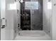 Bathroom with a bathtub and glass shower with marble tile at 2972 Lake Saxon Dr, Land O Lakes, FL 34639