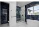 Spa-like bathroom with soaking tub, walk-in shower, and marble tile at 2972 Lake Saxon Dr, Land O Lakes, FL 34639