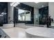 Elegant bathroom with double sinks, quartz countertop, and dark blue marble at 2972 Lake Saxon Dr, Land O Lakes, FL 34639