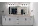 Double vanity bathroom with white cabinets and marble countertops at 2972 Lake Saxon Dr, Land O Lakes, FL 34639