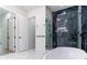 Spa-like bathroom with soaking tub, glass shower, and marble floors at 2972 Lake Saxon Dr, Land O Lakes, FL 34639
