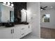 Modern bathroom with double vanity, black sinks, and marble tile at 2972 Lake Saxon Dr, Land O Lakes, FL 34639