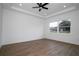 Bright bedroom with hardwood floors and large window at 2972 Lake Saxon Dr, Land O Lakes, FL 34639