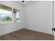 Bright bedroom with wood-look flooring and a window at 2972 Lake Saxon Dr, Land O Lakes, FL 34639