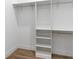 Spacious reach-in closet with shelves and hanging rods at 2972 Lake Saxon Dr, Land O Lakes, FL 34639